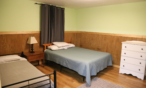 View of bed room with queen bed.