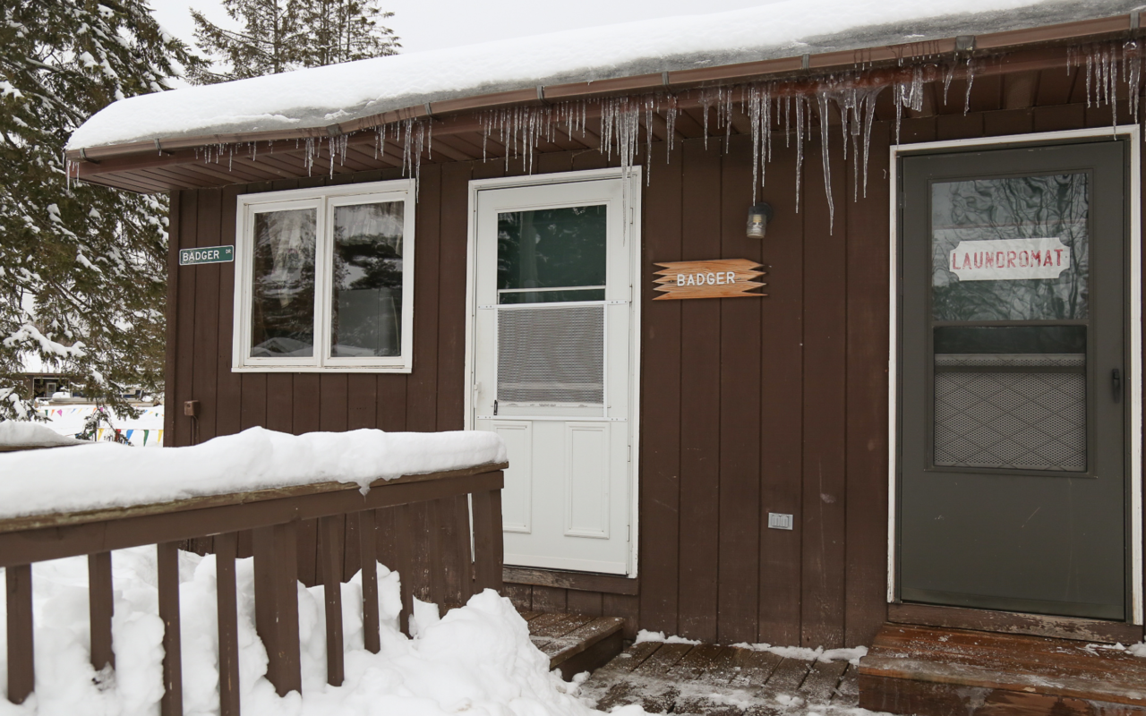 Exterior view of cabin in winter.
