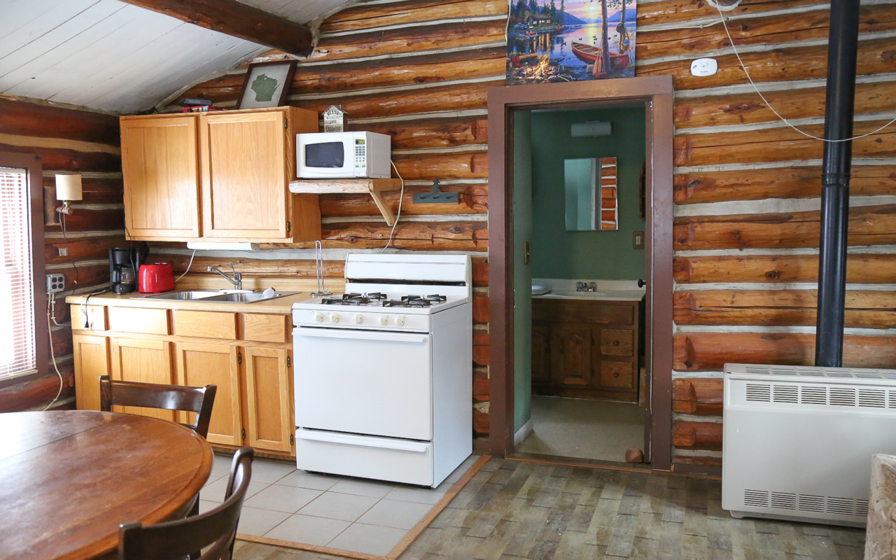 Indoor view of a cabin's kitchen.