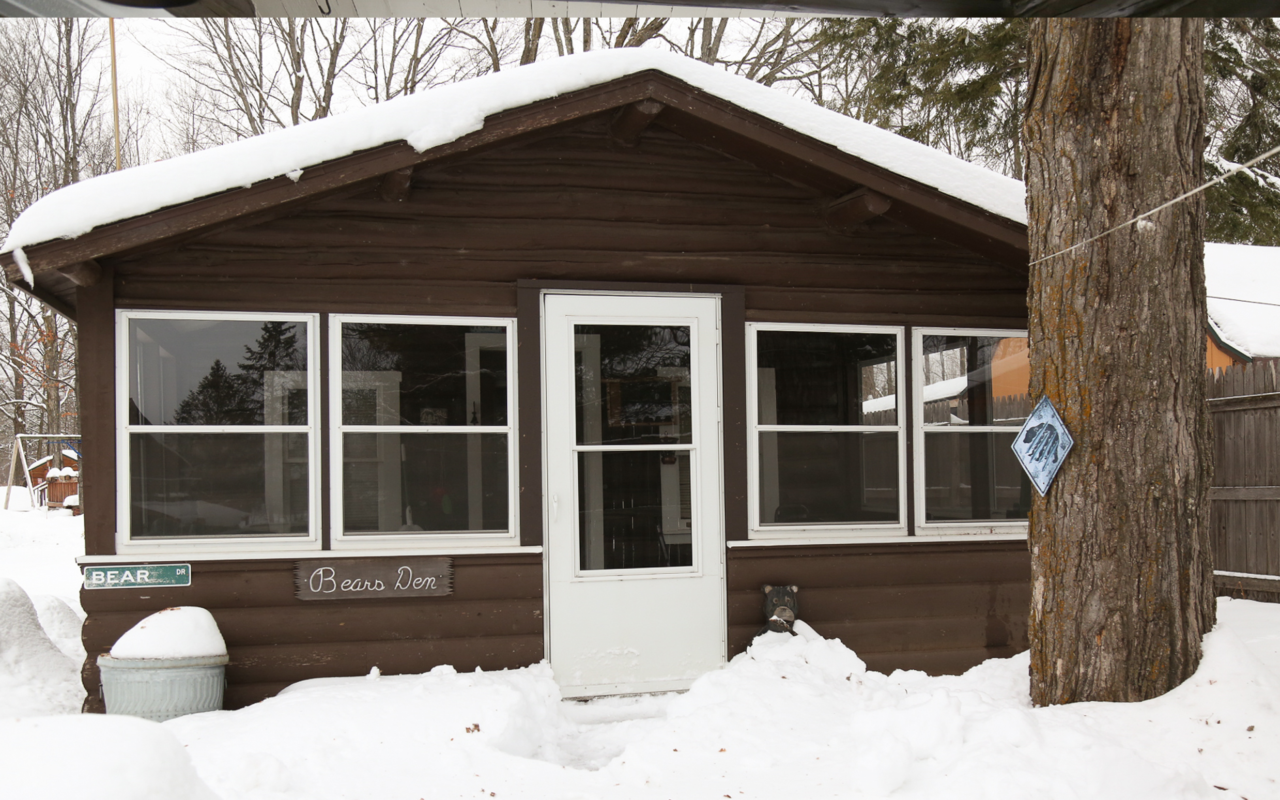 Front door view of a rustic cabin.