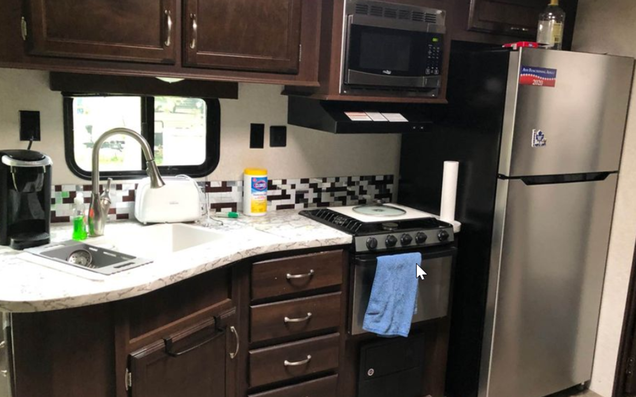 Interior view of camper showing kitchen.