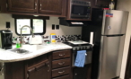 Interior view of camper showing kitchen.
