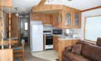 Cabin interior view of kitchen.