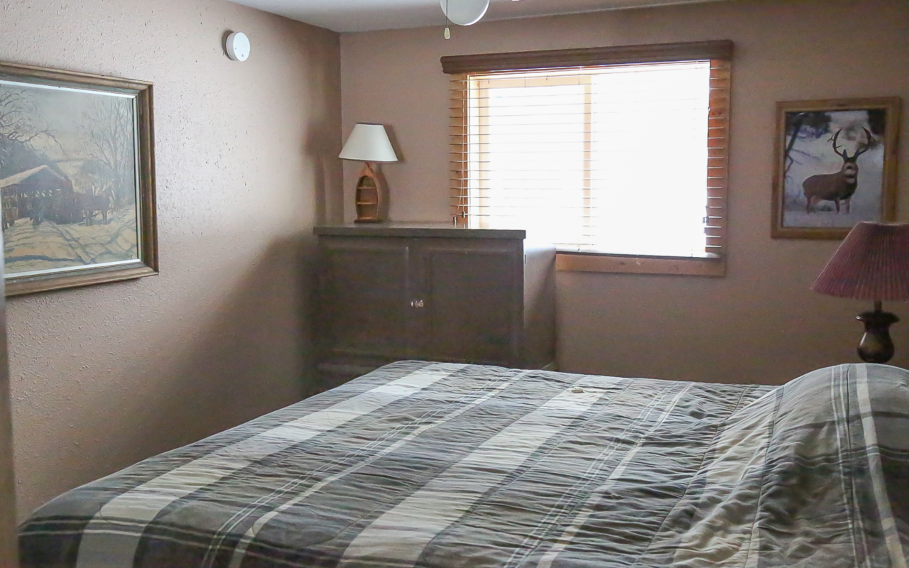 Interior cabin view of queen bedroom.