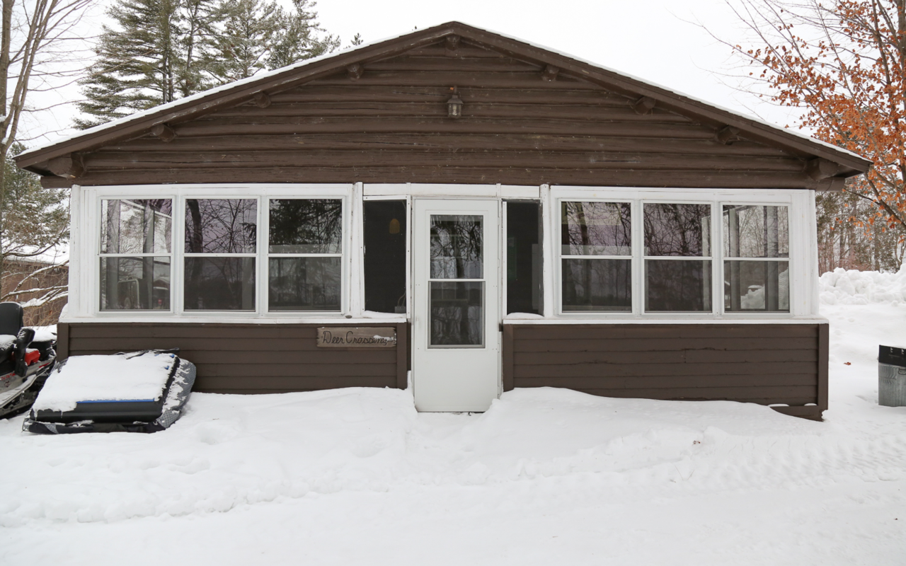 Exterior view of four-bedroom cabin in winter.