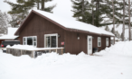 Exterior cabin view in winter.