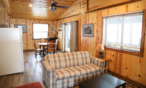 Interior cabin view of sit in kitchen and sofa.