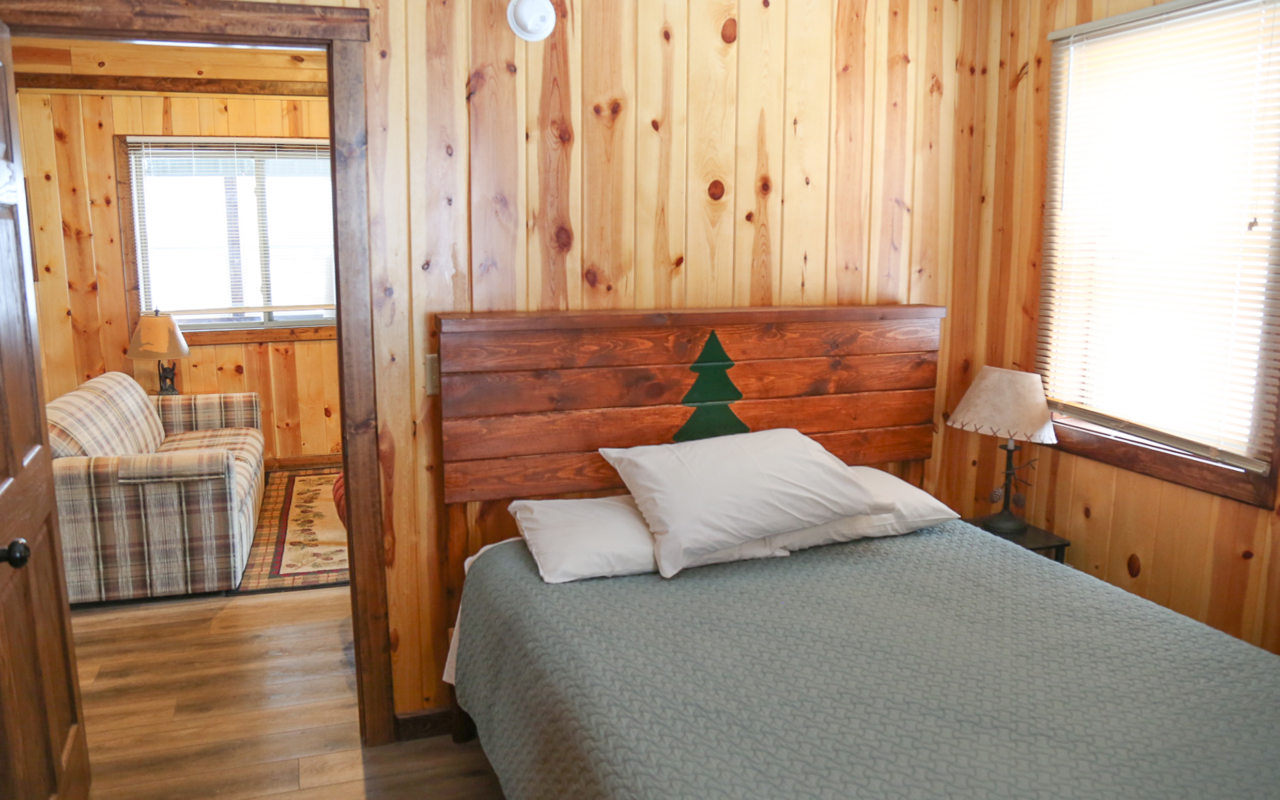 Interior cabin view of bedroom.