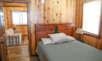 Interior cabin view of bedroom.