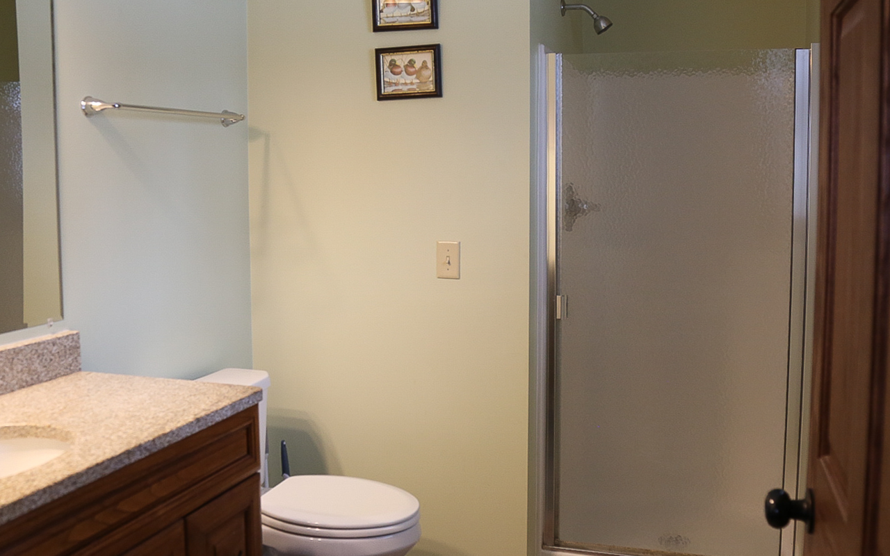 Interior cabin view of bathroom with shower.