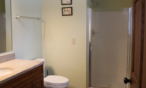 Interior cabin view of bathroom with shower.