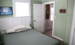 Interior cabin view of one queen bed.