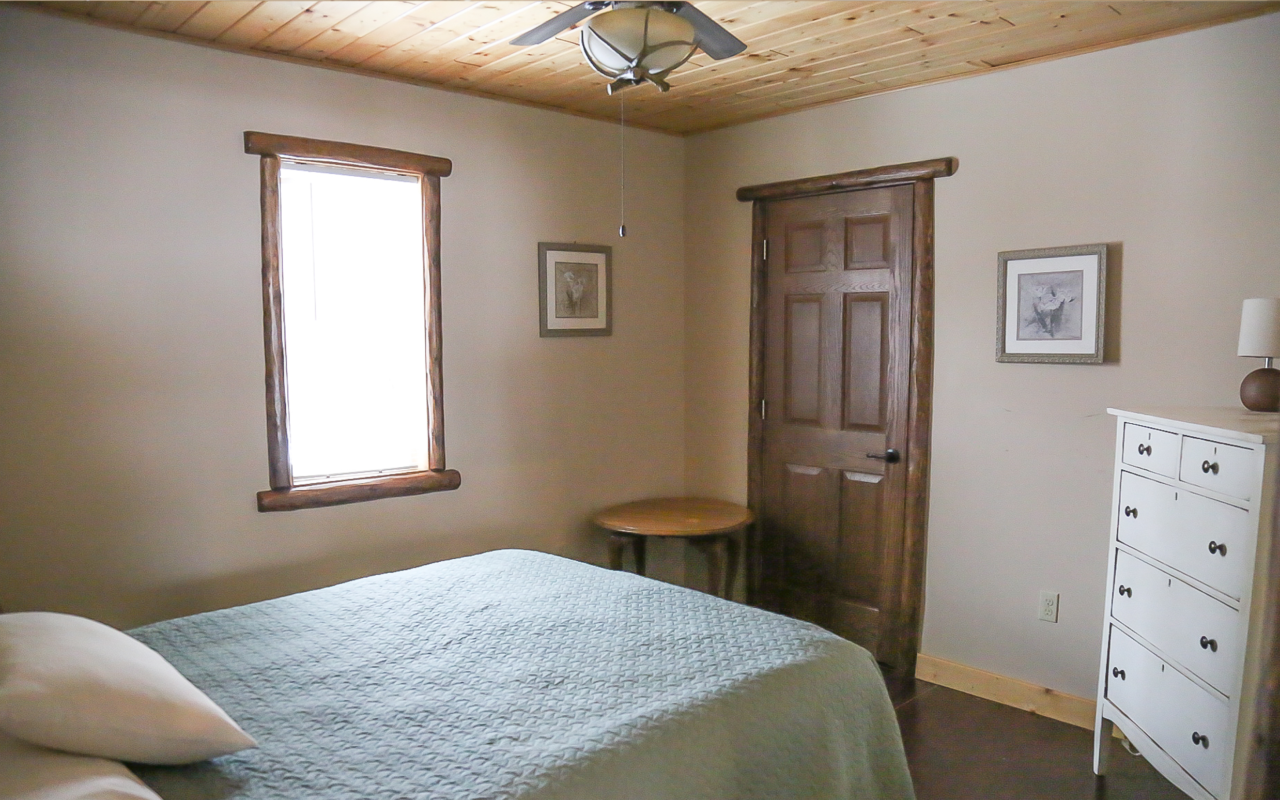Cabin interior view of bedroom.