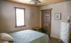 Cabin interior view of bedroom.