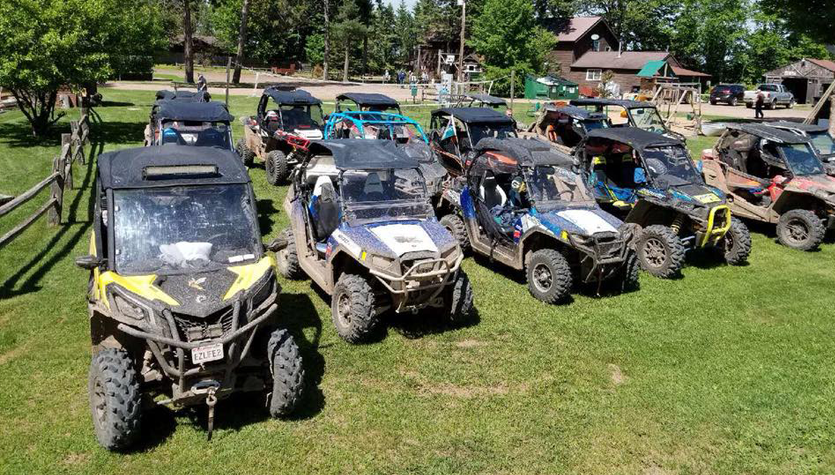 Group of ATVs parked in the grass