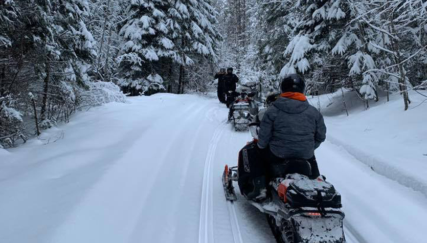Snowmobilers riding the trails.