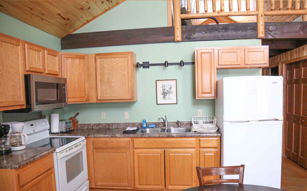 Interior cabin view of kitchen.