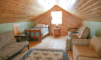 Interior cabin view of loft with twin bed and futon.