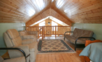 Interior cabin view of loft facing the stairway.