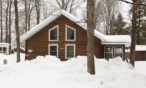 Exterior view of three-bedroom cabin.